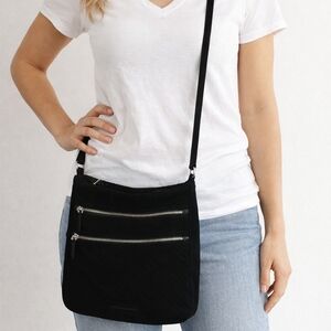 Sleek Black Crossbody Bag with Zipper Details